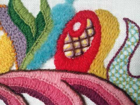 A sampler of a variety of filling stitches: in purple is chain stitch; green and pink, blankets stitch; blue, turkey knots; red, satin stitch; brown etc, lattice; mustard, burden stitch ; light blue, couched lattice.