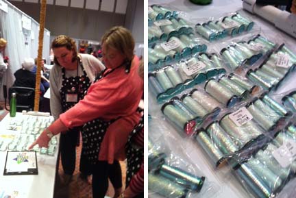 Behind The Trade Show Curtain Shop owners Meredith Willet and Alison Hodgkiss look at the new Kreinik metallic thread color, 9032 Easter Braid, which debuted at the February 2013 TNNA trade show.