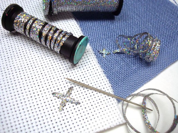 Size Does Matter - Picking The Right Cross Stitch Threads Kreinik has two sizes of metallic ribbons for stitching. Use your needle or finger to keep the ribbon flat as you place your stitch.