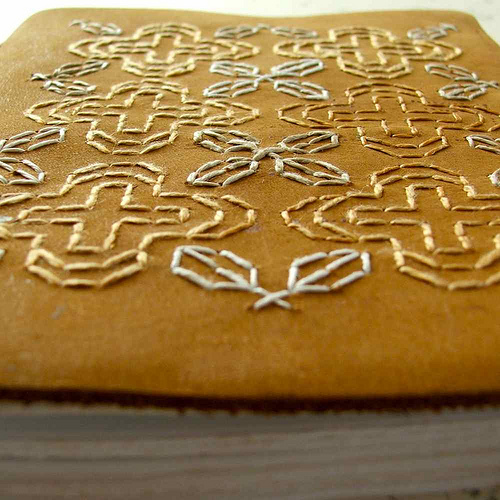 Nat Uhing | Hand Embroidery Blackwork embroidery on leather journal by Smallest Forest