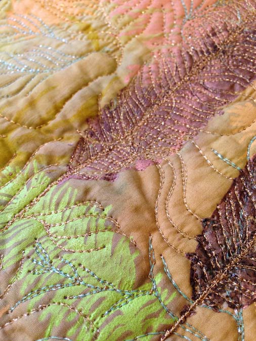 Bring On The Light Close up of Sam Packer's feather design showing the metallic machine sewing threads (Kreinik brand).