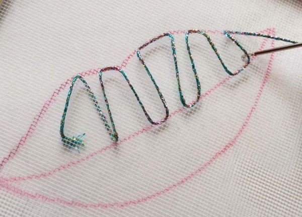 String Art - The Next Generation Is Shiny Sample from the Kreinik String Art On Canvas kits. Trace an outline onto the canvas, then make random stitches with metallic threads.