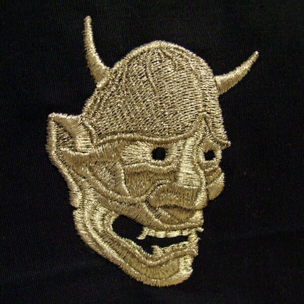 Single Color Machine Embroidery - One Thread, Many Qualities Hannya Mask Embroidery Design by Erich Campbell