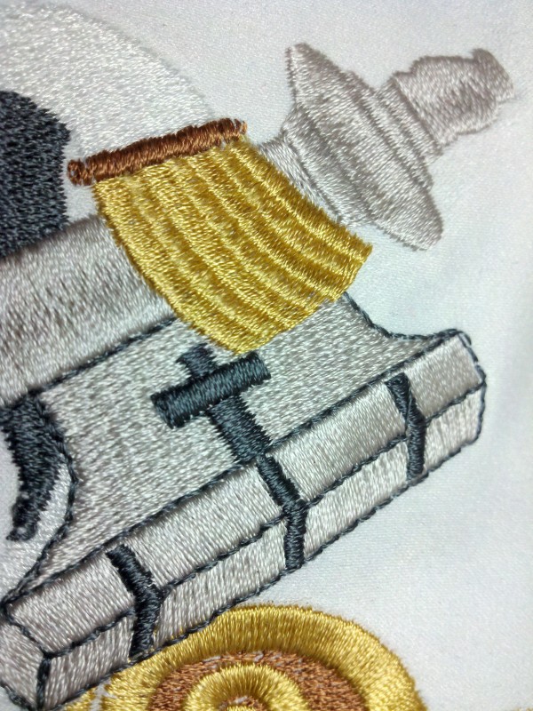 Digitizing With Dimension | Machine Embroidery Silver Key and Sash Detail
