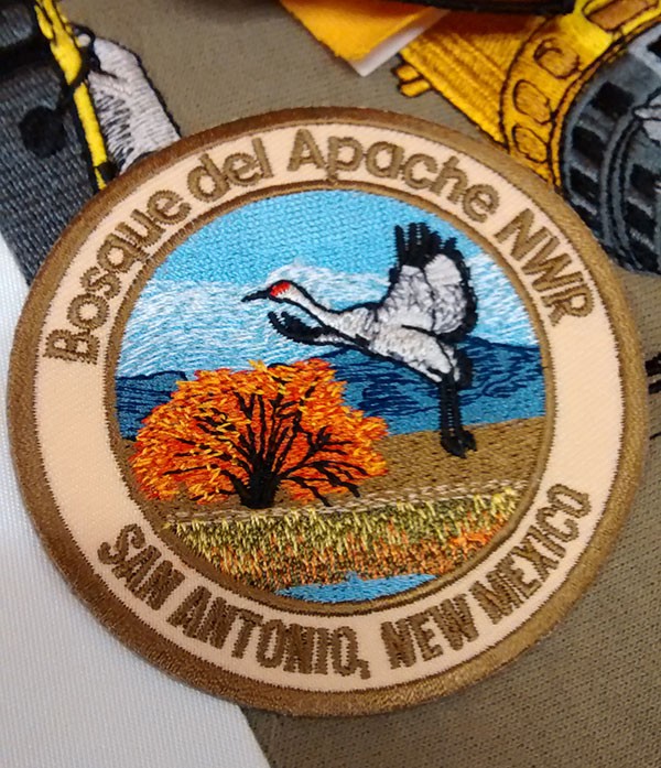 Density Is Our Destiny | Machine Embroidery Patch showing light fills for effect- a crane taking off from Bosque del Apache